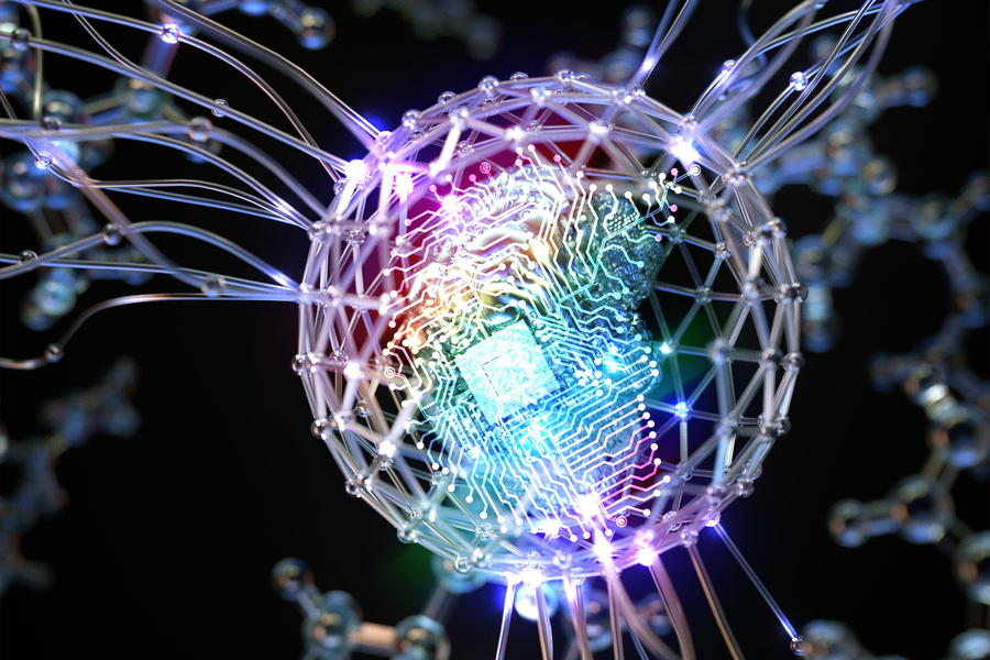 A futuristic illustration of a glowing microchip surrounded by a spherical lattice structure, with interconnected nodes and wires extending outward. The chip is illuminated with vibrant rainbow colors, symbolizing advanced technology.