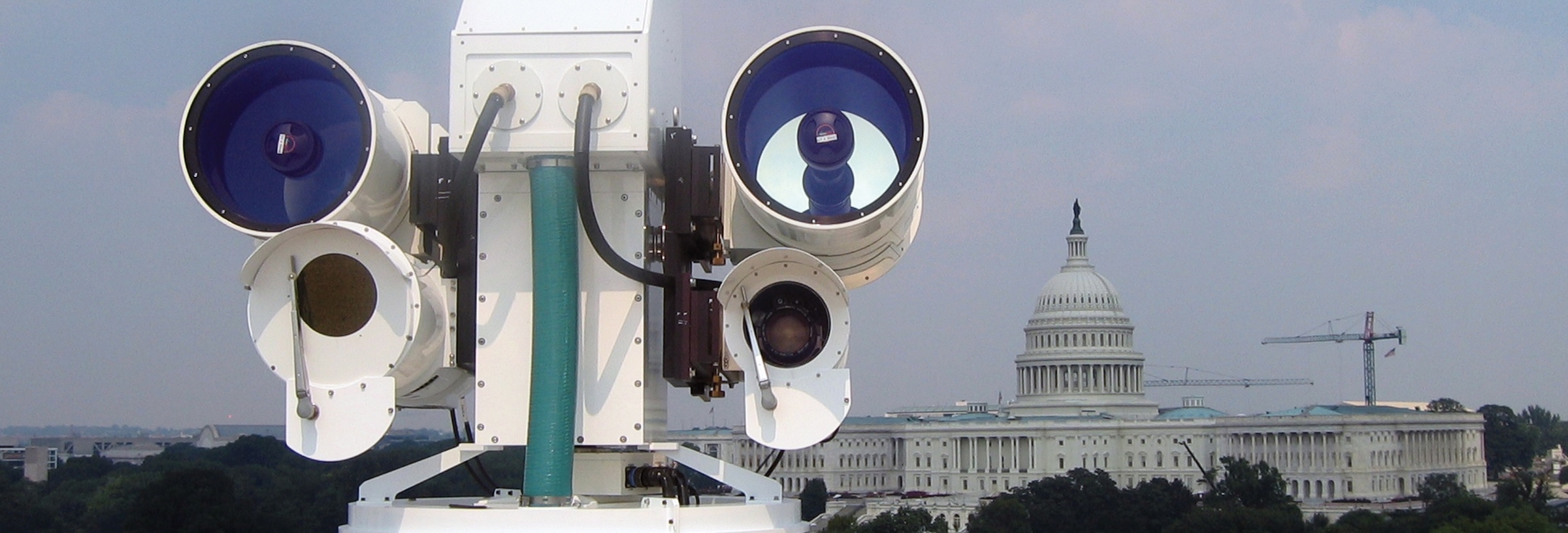 An optical imaging system is set up on a rooftop in Washington DC, with the US Capitol in view in the background. 